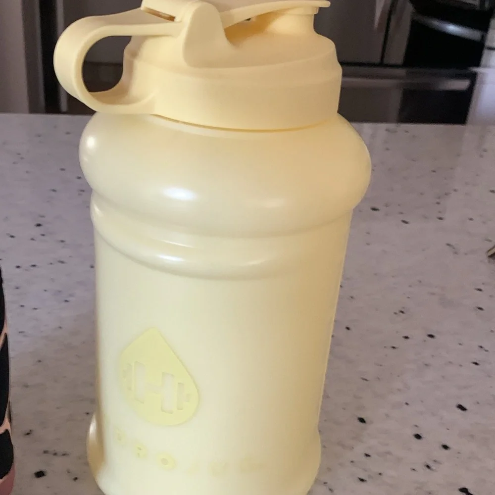 HydroJug Yellow Water Bottle with Pink and Black Neoprene Sleeve